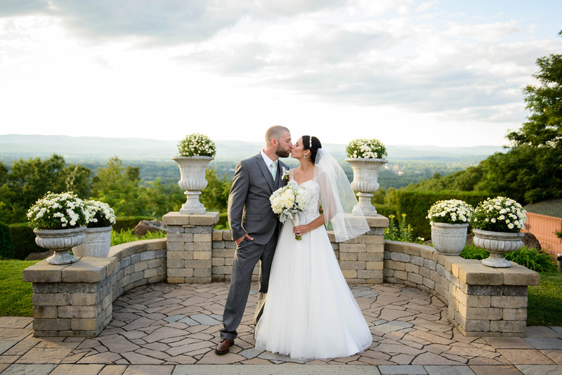 Bride and groom kissing portrait